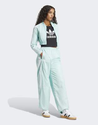 adidas Originals - Adicolor Teamgeist - Oversize-Trainingshose in Semi Flash-Blau