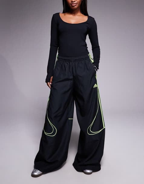 adidas Originals Adicolor Teamgeist track pants in black and bright green - view 1