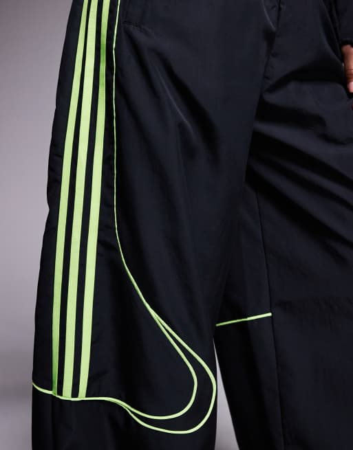 adidas Originals Adicolor Teamgeist track pants in black and bright green