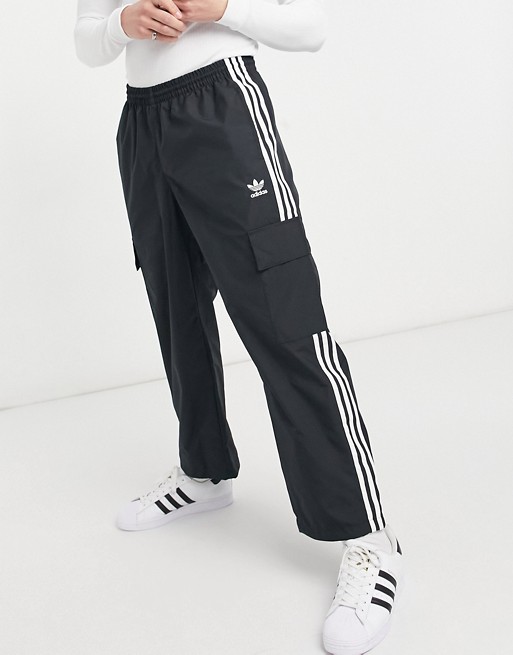 adidas Originals adicolor three stripe cargo trousers with pocket detail in black