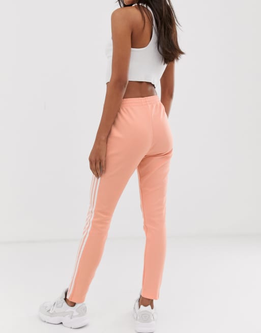 adidas Originals adicolor three stripe cigarette pant in pink