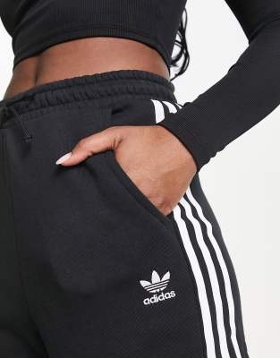 adidas originals adicolor three stripe cuffed joggers in black