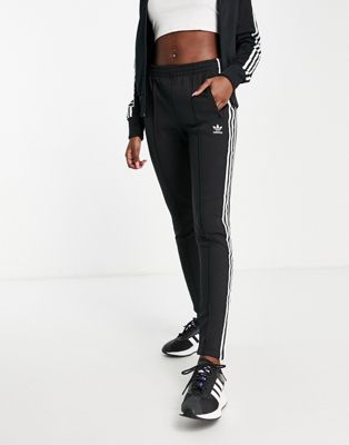 adidas Originals adicolor three stripe cuffed joggers in black