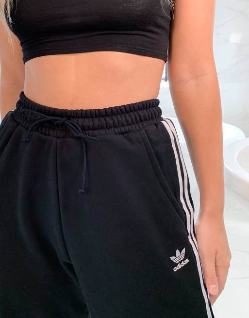 Adidas originals adicolor three stripe cuffed joggers in black hot sale