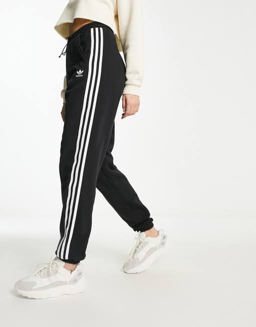 adidas Originals adicolor three stripe cuffed trackies in black ASOS
