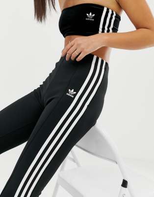 adidas originals three stripe flared track pants in black