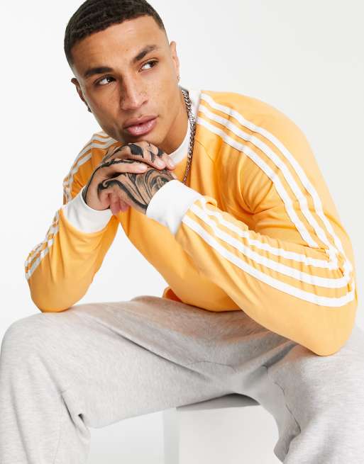 adidas Originals adicolor three stripe long sleeve t shirt in hazy orange