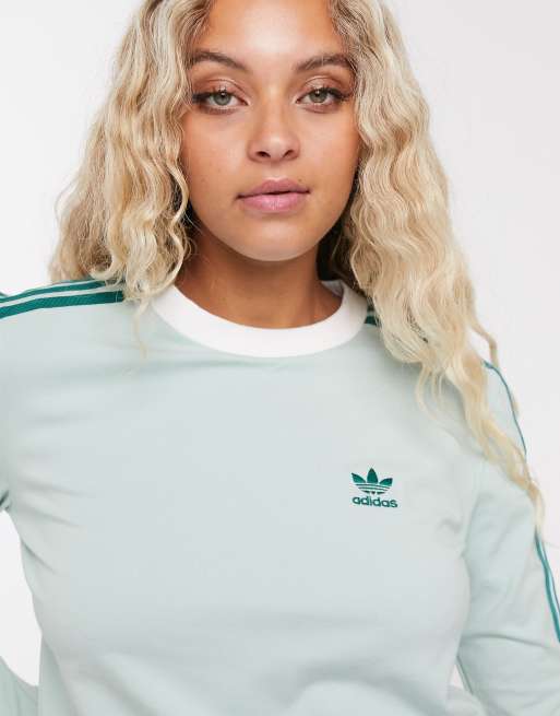 Mint green adidas top discount