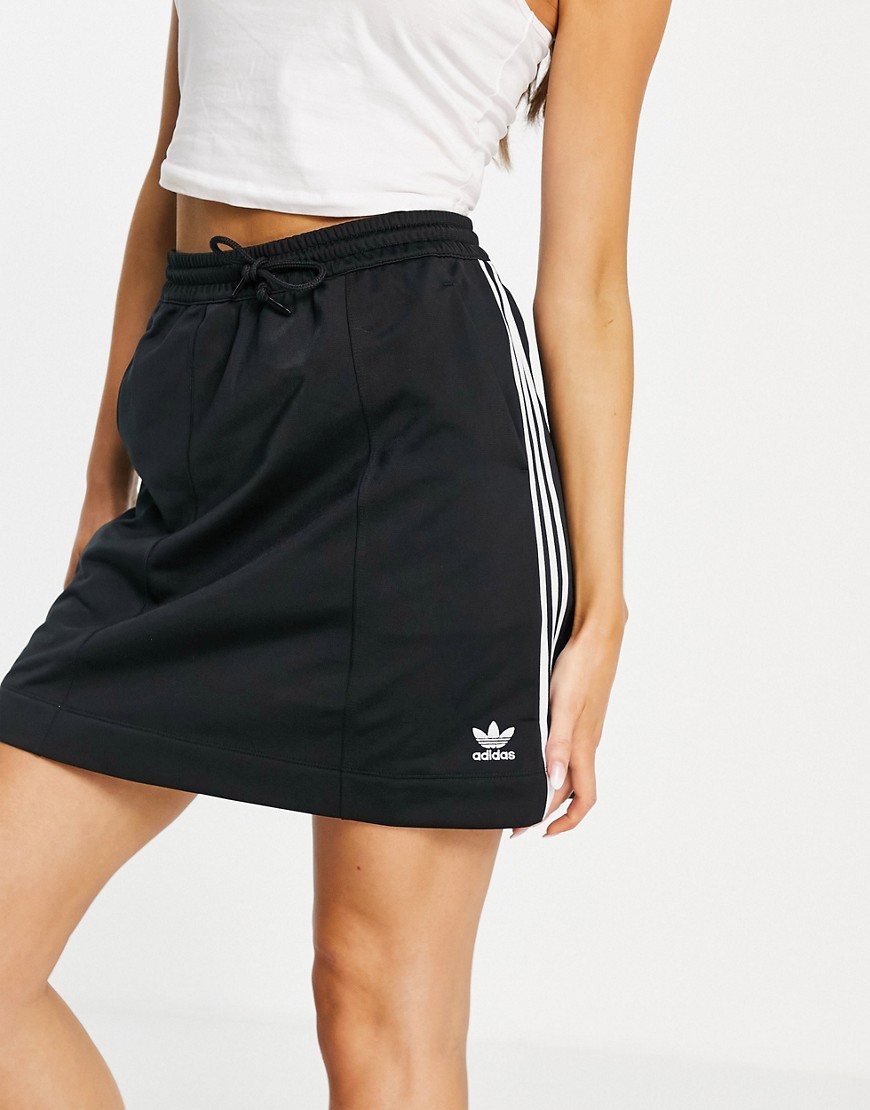 Adidas Originals adicolor three stripe mini skirt in black with drawstring waist