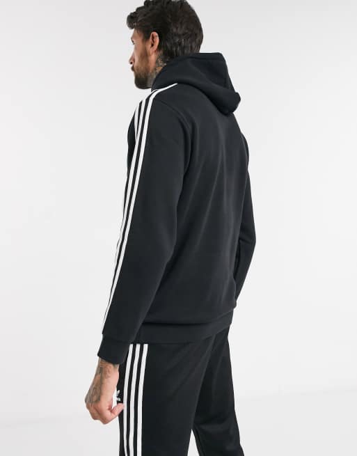 adidas Originals adicolor three stripe quarter zip hoodie in black