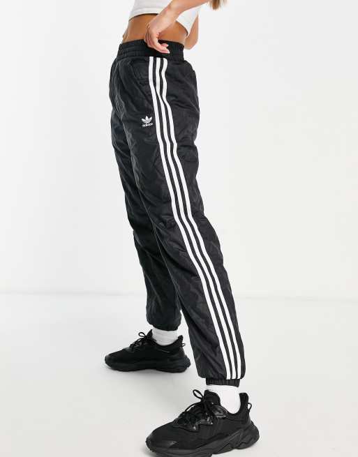 Adidas originals three stripe track pant in black on sale