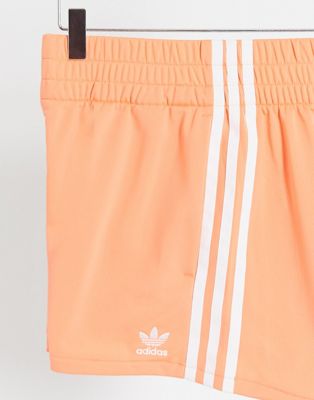 pink adidas three stripe shorts