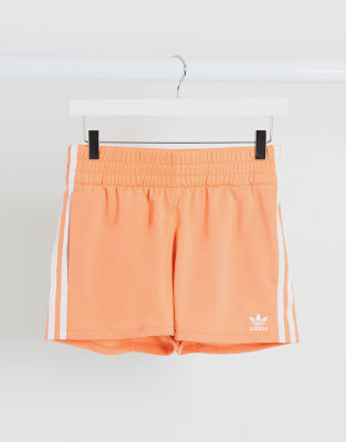 pink adidas three stripe shorts