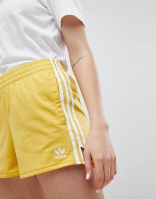 adidas originals adicolor three stripe shorts in yellow