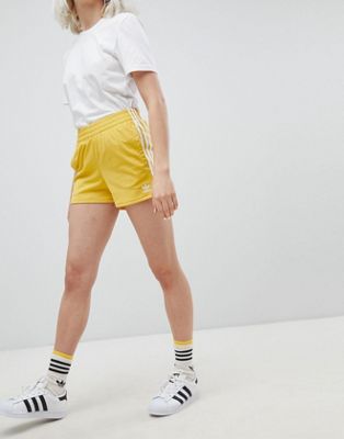 adidas originals adicolor three stripe shorts in yellow