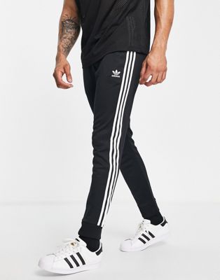 adidas Originals adicolor three stripe skinny joggers in black - BLACK