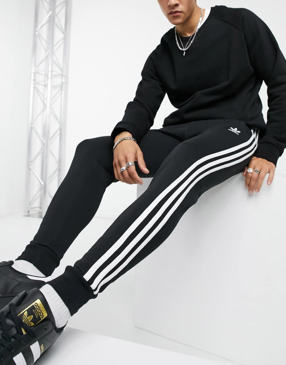 adidas Originals adicolor three stripe skinny joggers in black