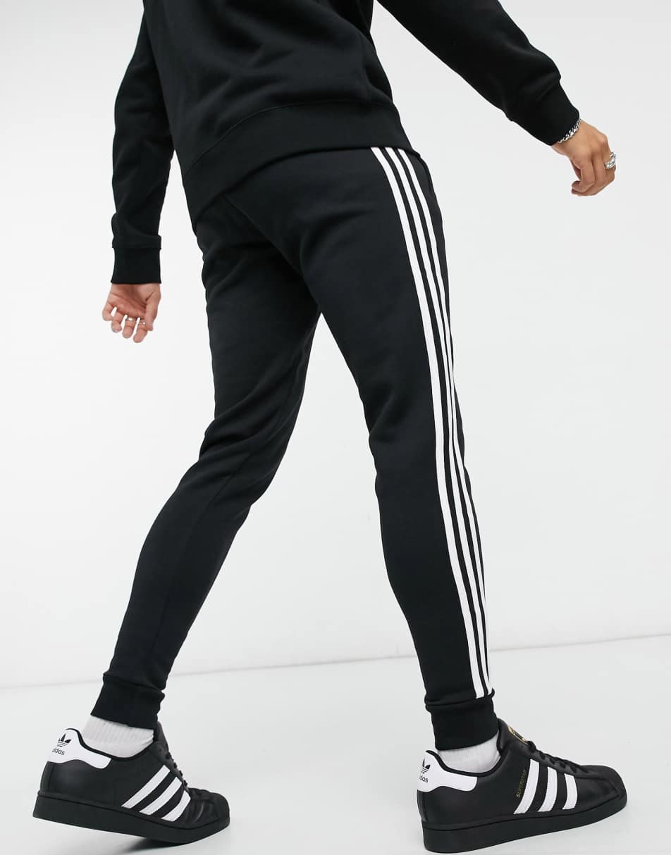 adidas Originals adicolor three stripe skinny joggers in black 0