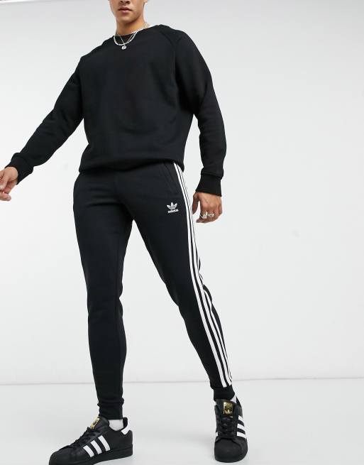 adidas Originals adicolor three stripe skinny joggers in black