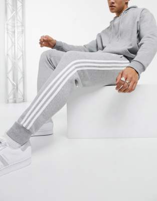 adidas originals adicolor three stripe skinny joggers in grey heather