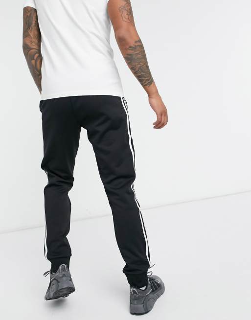 adidas Originals adicolor three stripe skinny sweatpants in black