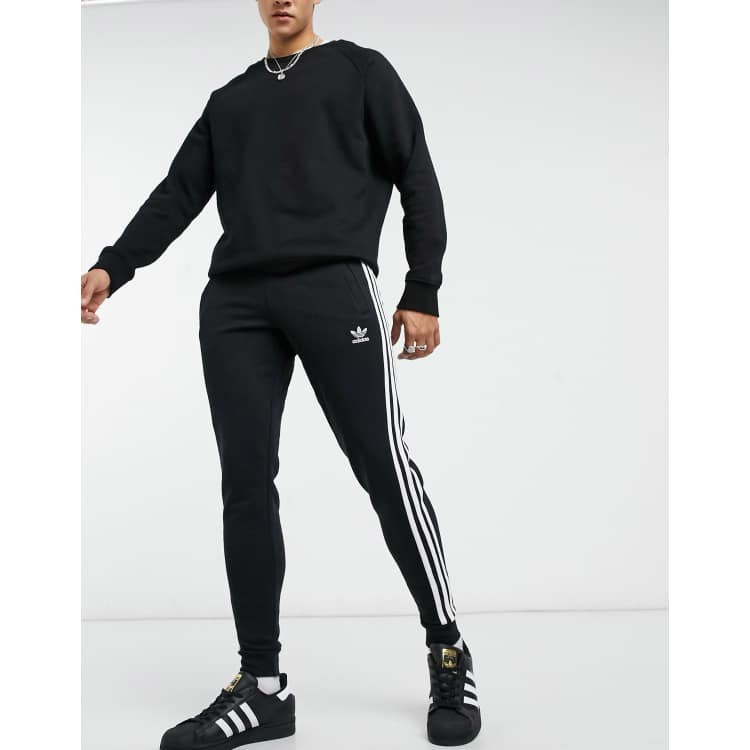 adidas Originals adicolor three stripe sweatpants in black