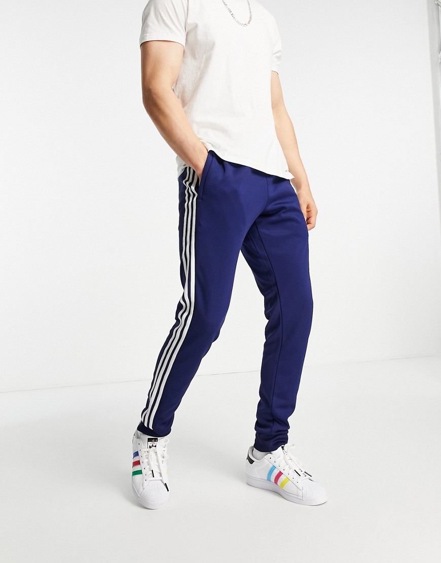 Adidas Originals adicolor three stripe sweatpants in navy