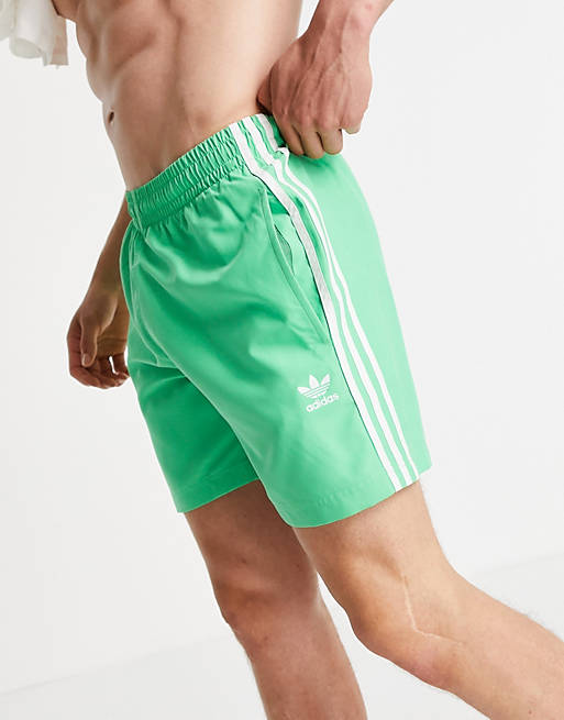 Swimwear adidas Originals adicolor three stripe swim shorts in green 