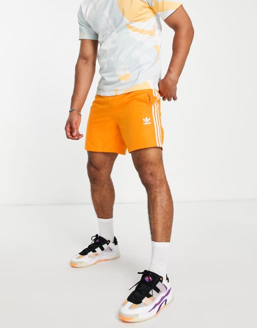 adidas Originals adicolor three stripe swim shorts in orange ASOS