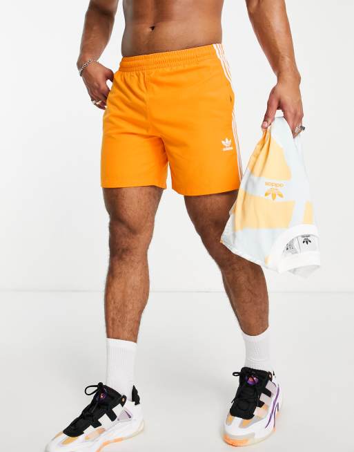 adidas Originals adicolor three stripe swim shorts in orange ASOS