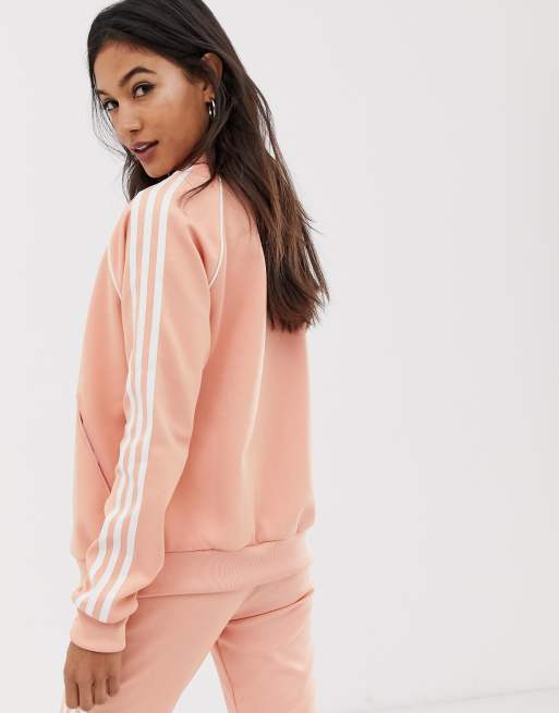 adidas Originals adicolor three stripe track jacket in pink