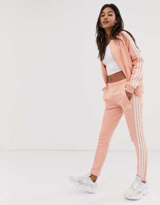 adidas originals adicolor three stripe track jacket in pink