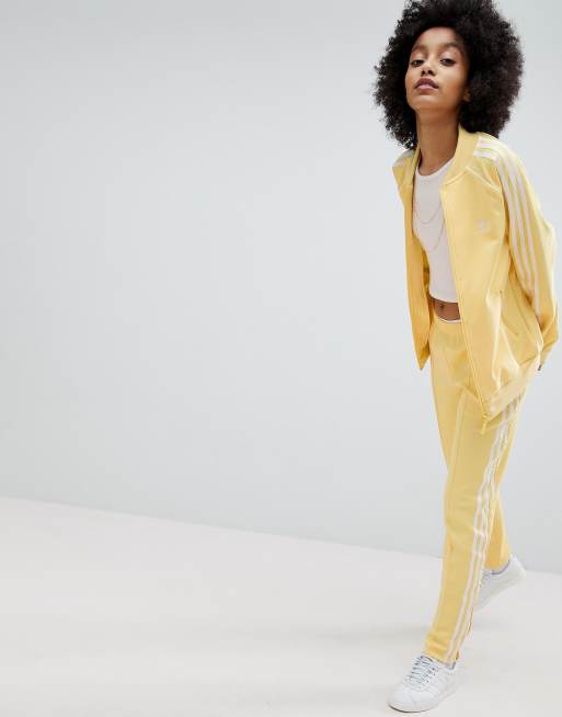 Yellow adidas jacket with white stripes sales