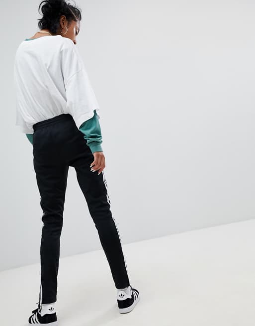 adidas Originals Adicolor Three Stripe Flared Pants In Black, $48, Asos