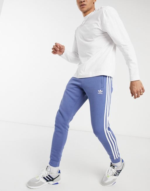 adidas Originals adicolor three stripe track pants in blue ASOS