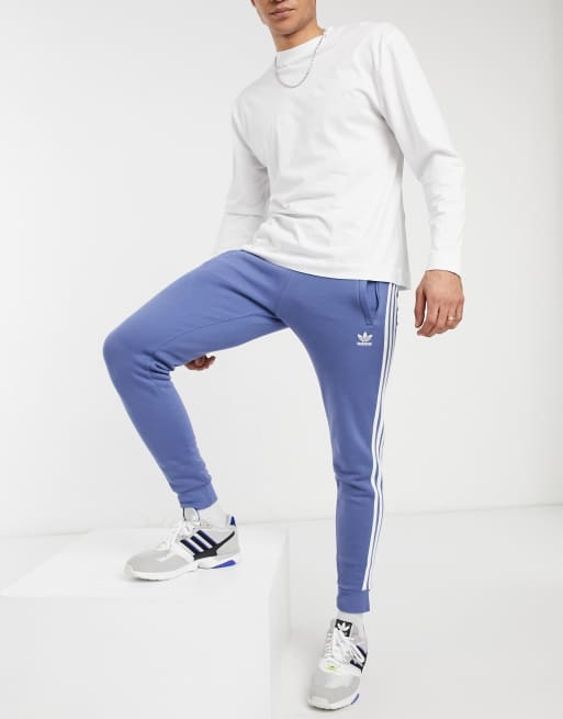 Adidas originals three stripe track pant in blue cheap