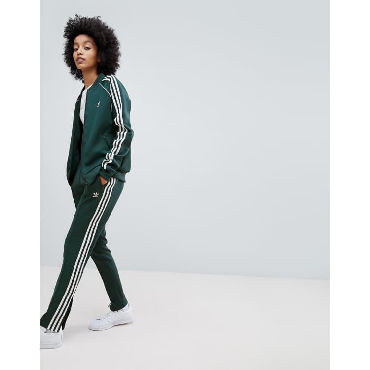 Adidas track pants green stripes on sale