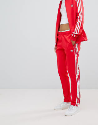 adidas originals adicolor three stripe track pants in red