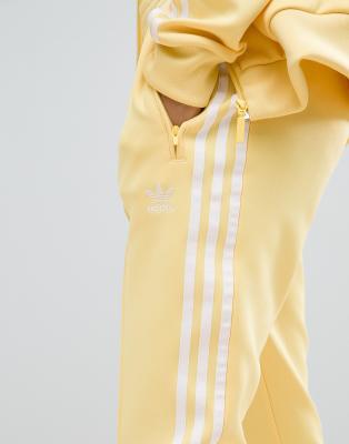 adidas track pants yellow stripe