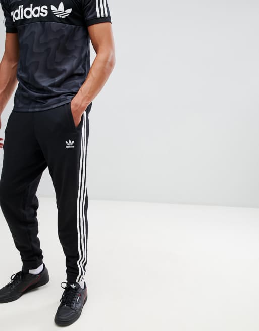 adidas Originals adicolor three stripe trackies in black CW2981 ASOS