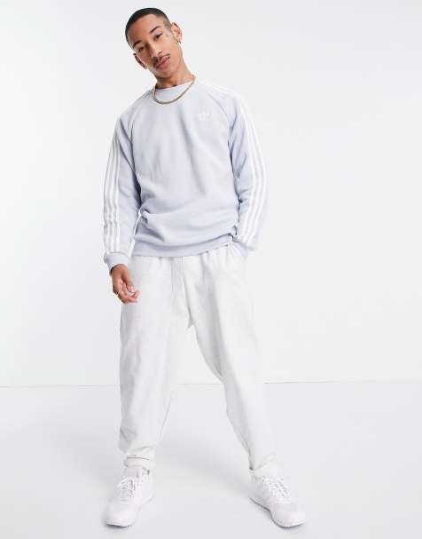 adidas Originals adicolor three stripes sweatshirt in pale blue - view 1