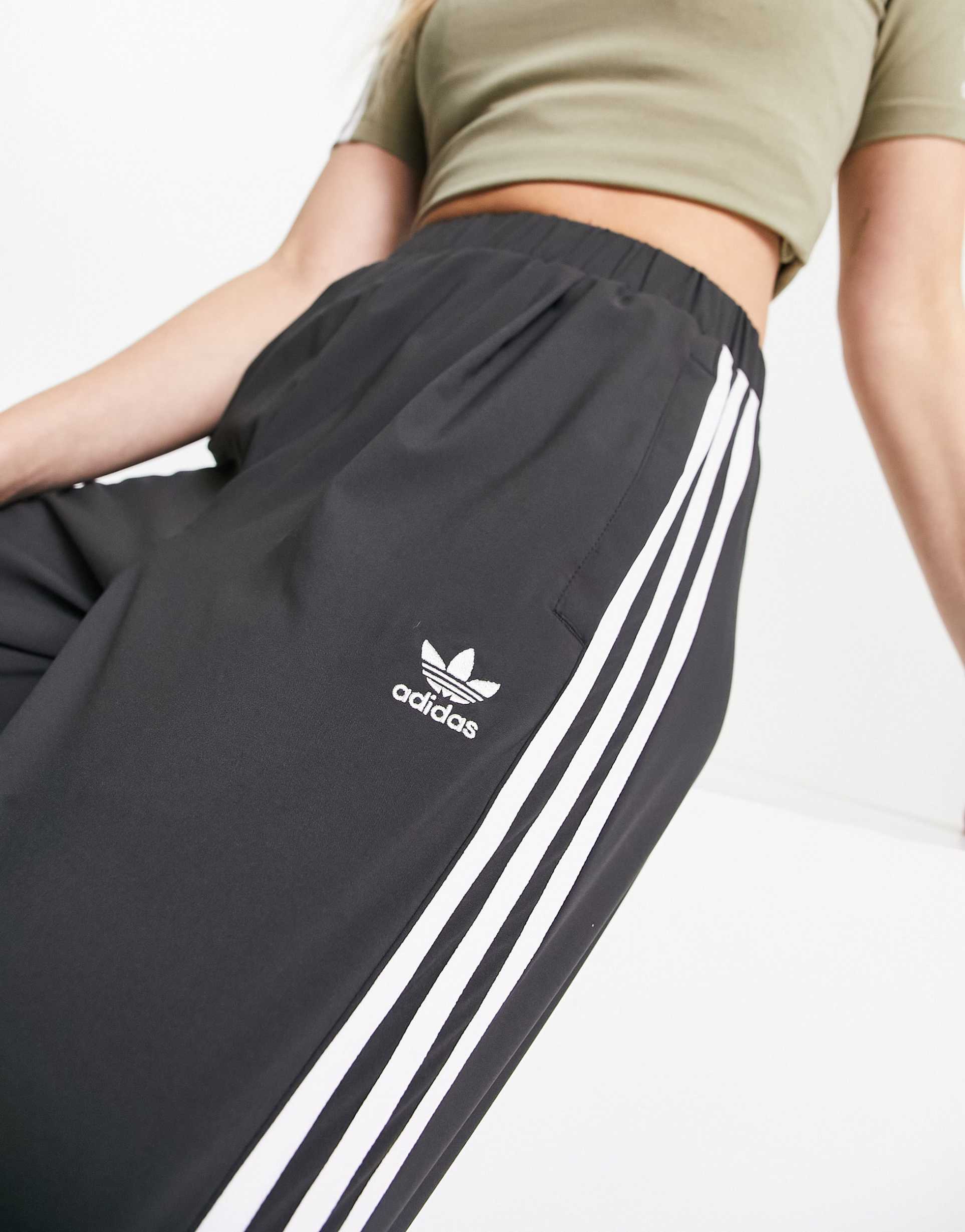 adidas Originals adicolor woven joggers in black view 4