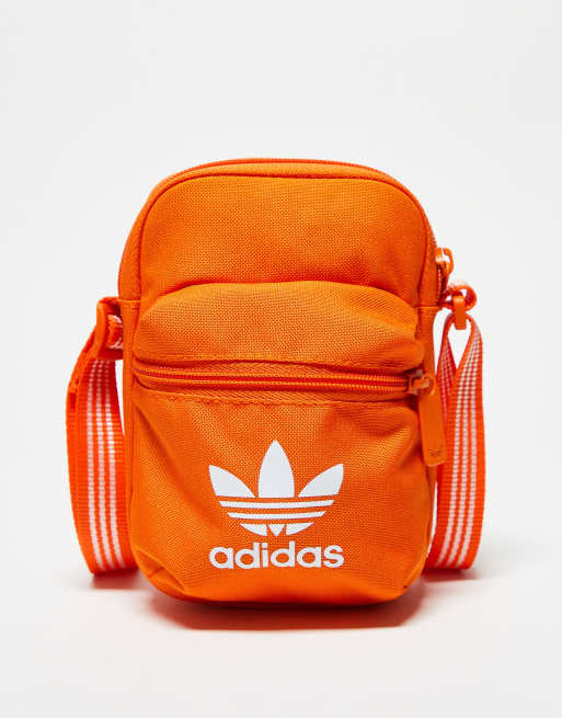 Orange adidas duffle bag on sale