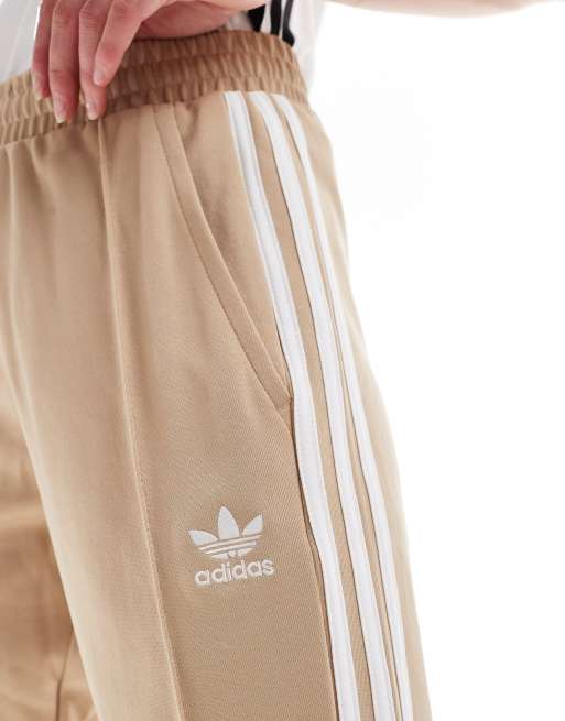 adidas Originals Adicolour flare tracksuit bottoms in beige