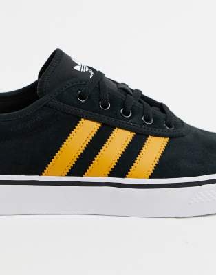 black and yellow adidas trainers