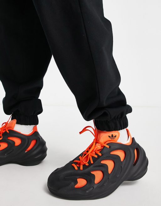 Black and shop orange adidas trainers