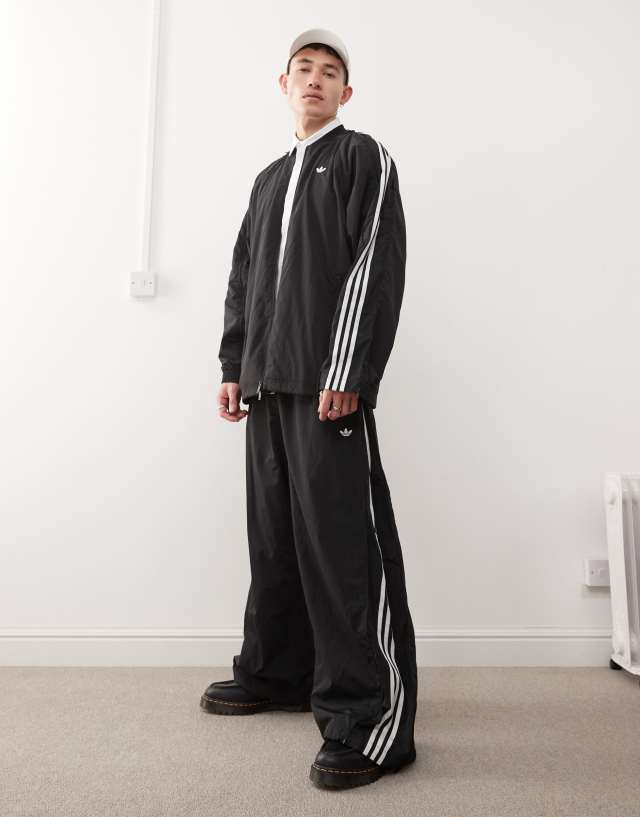 adidas Originals Adilenium Season 3 track pants in black | ASOS