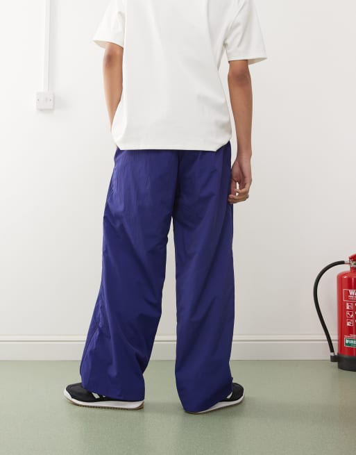 adidas Originals Adilenium Season 3 track pants in blue | ASOS