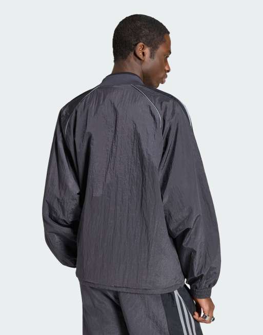adidas Originals Adilenium season 5 track top in utility black | ASOS