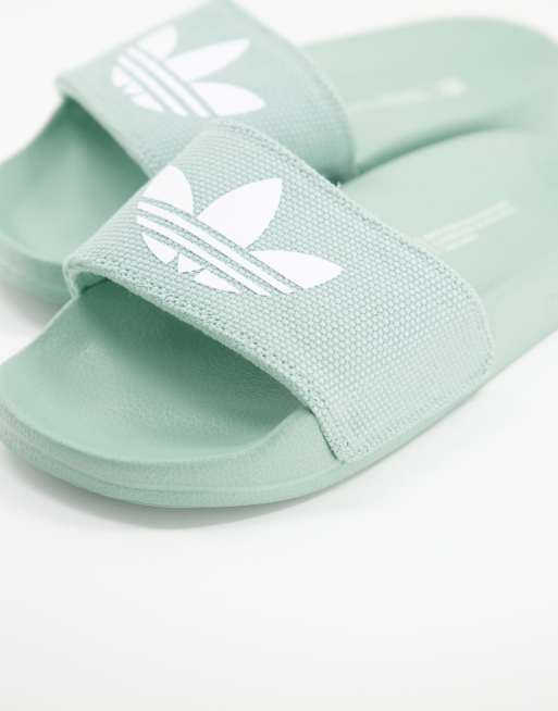 adidas Originals Adilette Lite sliders in hazy green ASOS